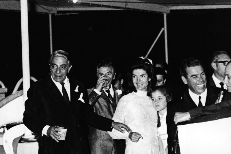 Aristotle Onassis, Jackie Kennedy, Caroline Kennedy on the 'Christina' yacht in 1968 for the couple's wedding reception (Getty Images)