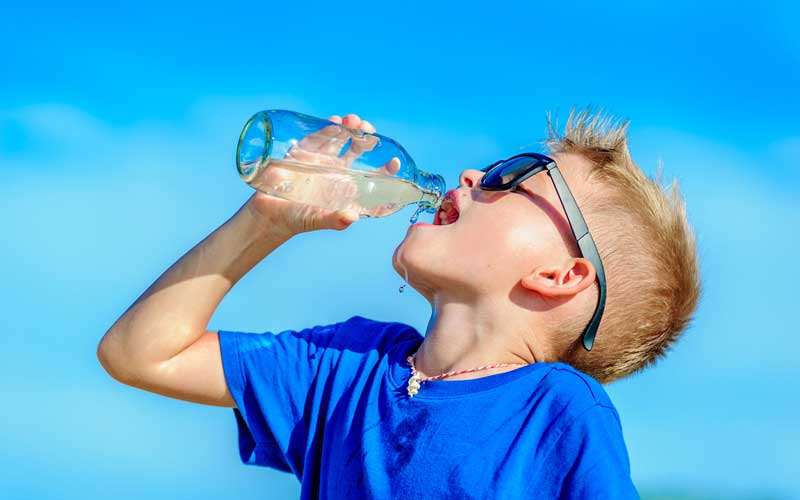 Boy drinking water. Credit: iStock