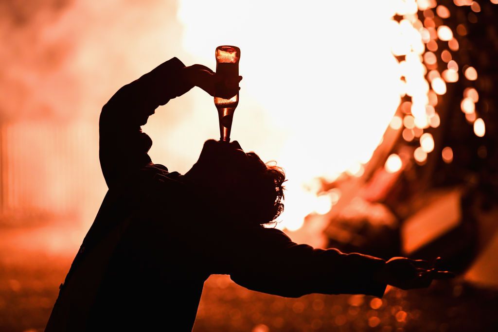 July 12, 2017: Loyalists gather in front of the bonfire on the Sandy Row area in Belfast. (Getty Images) July 12, 2017: Loyalists gather in front of the bonfire on the Sandy Row area in Belfast. (Getty Images)