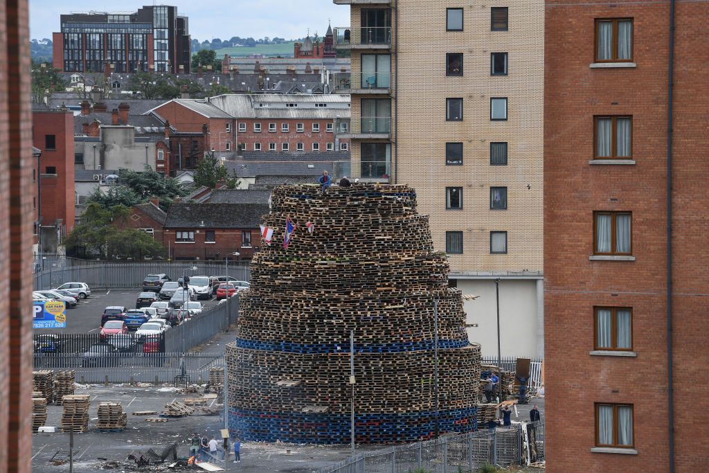 July 10, 2017: Loyalists sit on the Sandy Row bonfire being built in preparation for the 11th night bonfire on July 10, 2017, in Belfast, Northern Ireland. (Photo by Jeff J Mitchell/Getty Images.) July 10, 2017: Loyalists sit on the Sandy Row bonfire being built in preparation for the 11th night bonfire on July 10, 2017, in Belfast, Northern Ireland. (Photo by Jeff J Mitchell/Getty Images.)