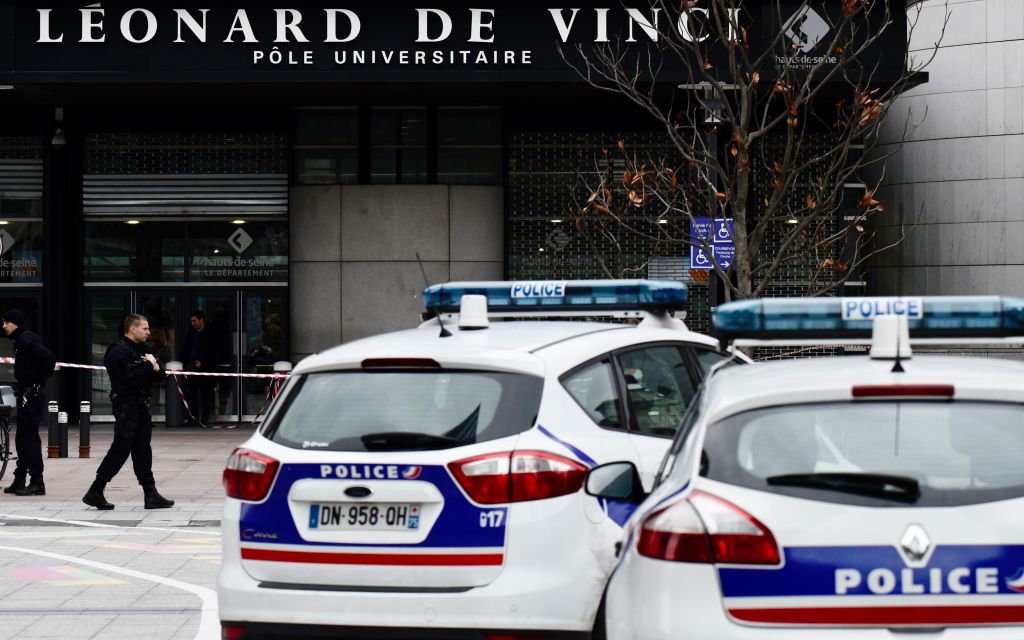 Police block the access on December 5, 2018 at the main entrance of the private Leonard-de-Vinci university in Courbevoie, northwest of Paris, where a 66-year-old teacher was repeatedly stabbed to death and a Pakistani suspect arrested. (Image: PHILIPPE LOPEZ/AFP/Getty Images)