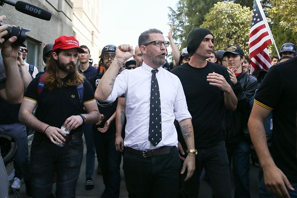 Right wing provocateur and Vice co-founder Gavin McInnes (C) pumps his fist during a rally at Martin Luther King Jr. Civic Center Park on April 27, 2017 in Berkeley, California. (Photo by Elijah Nouvelage/Getty Images)