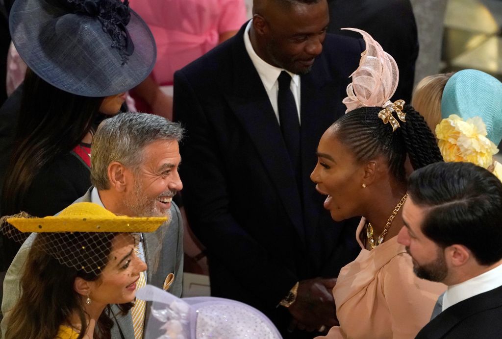 US actor George Clooney (2L) and his wife British lawyer Amal Clooney (L) talk with US tennis player Serena Williams (2R) and her husband Alexis Ohanian (R) during the wedding ceremony of Britain's Prince Harry, Duke of Sussex and US actress Meghan Markle in St George's Chapel, Windsor Castle, in Windsor, on May 19, 2018. (OWEN HUMPHREYS/AFP/Getty Images)