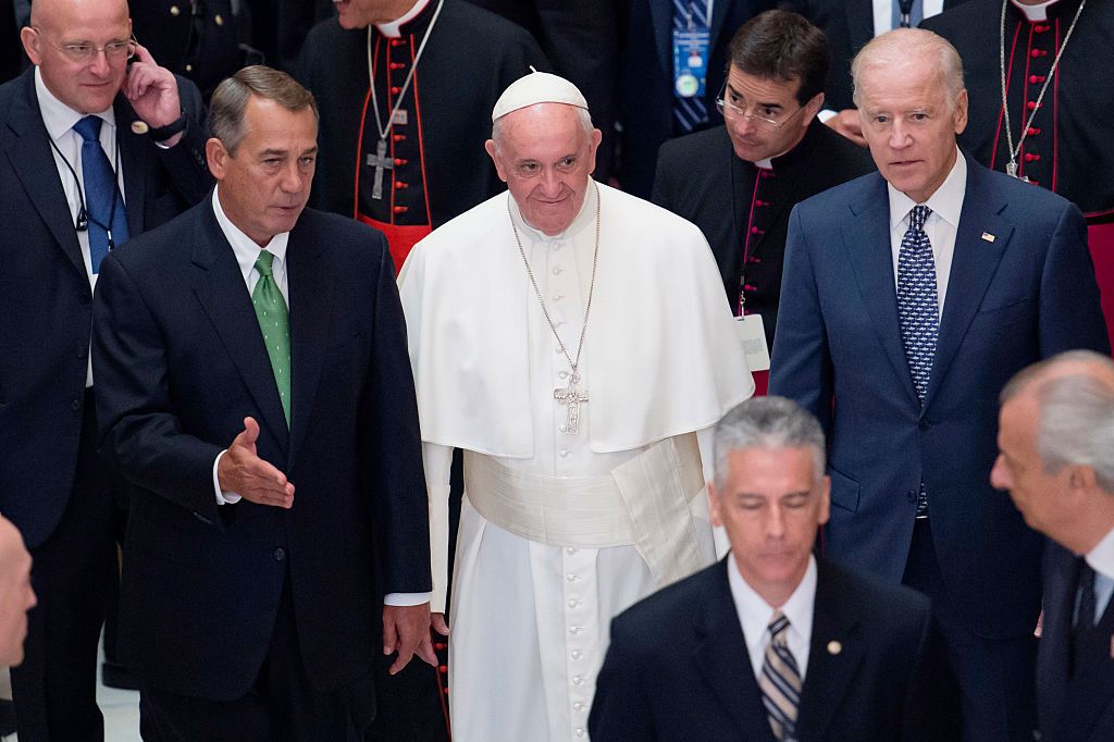 Pope Francis (C) walks with Speaker of the House John Boehner (R-OH) (L) and US Vice President Joe Biden (R), after deliver an address to a joint session of Congress, in Statuary Hall at the U.S. Capitol on September 24, 2015, in Washington, DC. (Photo by Michael Reynolds-Pool/Getty Images)
