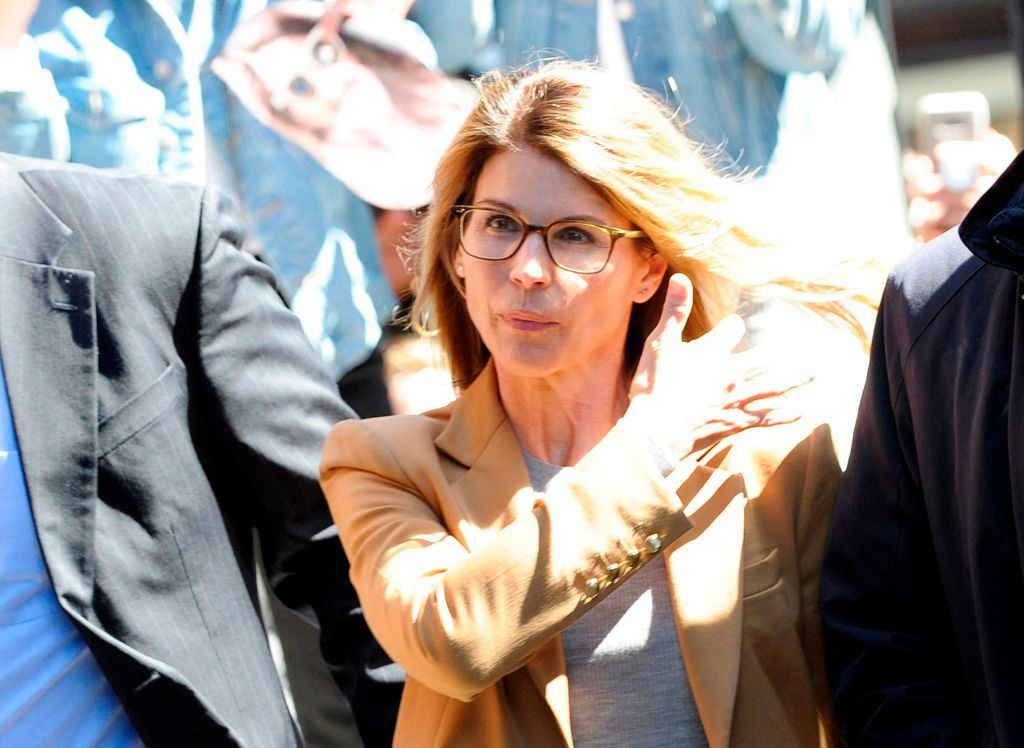 Actress Lori Loughlin (C) arrives at the court to appear before Judge M. Page Kelley to face charge for allegedly conspiring to commit mail fraud and other charges in the college admissions scandal at the John Joseph Moakley United States Courthouse in Boston, Massachusetts on April 3, 2019. (Photo by Joseph Prezioso / AFP)