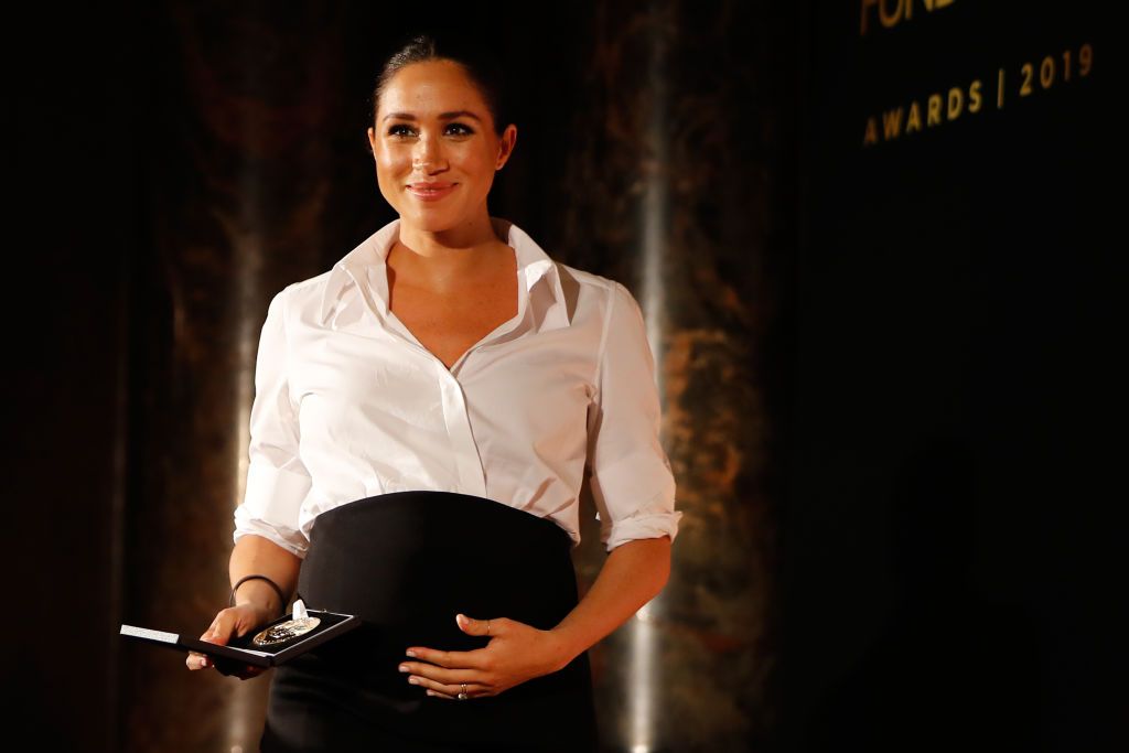 Meghan, Duchess of Sussex presents the Celebrating Excellence Award to Nathan Forster, a former soldier of the Army's Parachute Regiment, at the Endeavour Fund awards at Drapers' Hall on February 7, 2019, in London, England. Image credit: Tolga Akmen -WPA Pool/Getty Images.