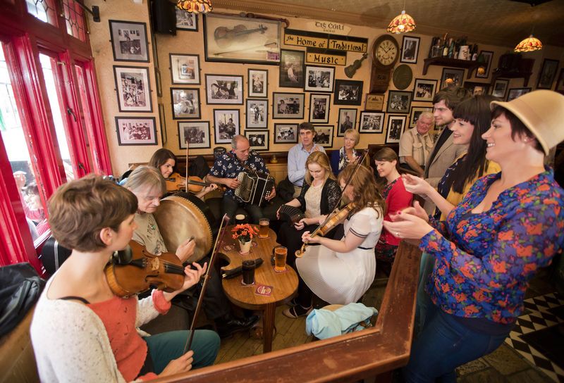A bodhrán player sits in on an Irish music session in Galway (Ireland's Content Pool)
