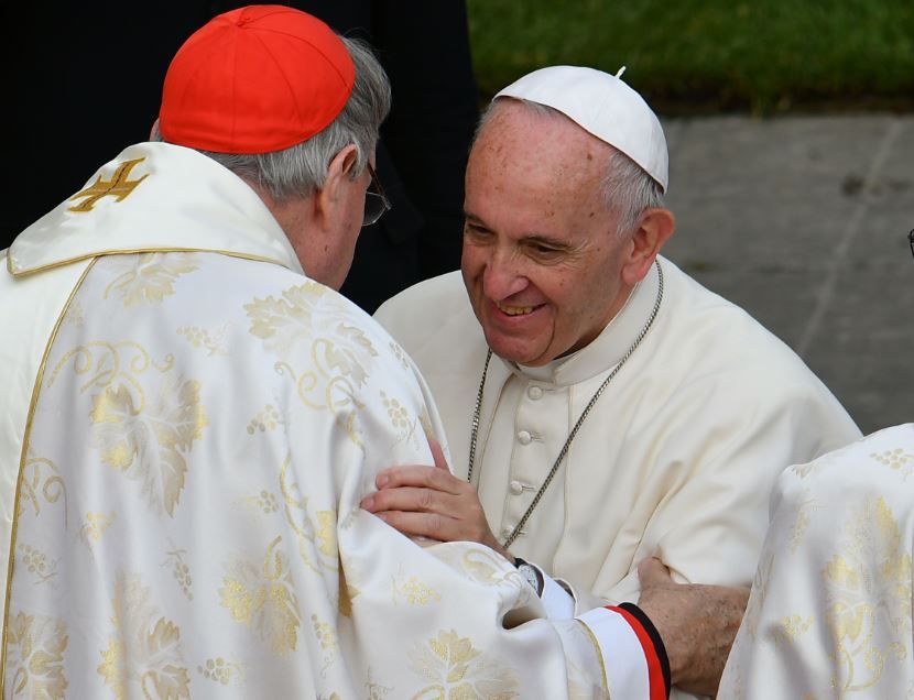 Pope Francis (C) greets cardinal George Pell (L) of Australia after the celebration of a mass marking the end of the Jubilee of Mercy, on November 20, 2016 in the Vatican. Image: Getty