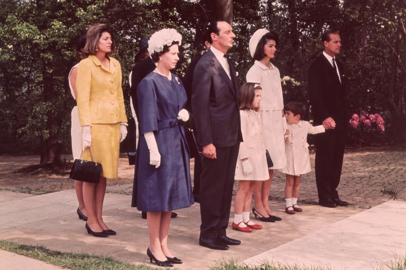 Queen Elizabeth II and Prince Philip with Jackie Kennedy and her children John Jr. and Caroline during the inauguration of Britain's Kennedy memorial at Runnymede. (Getty Images)