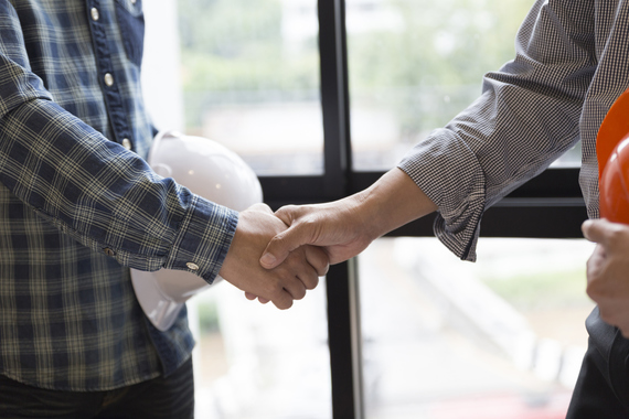 Construction business men shake hands. Credit: iStock