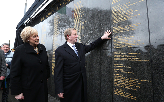 Taoiseach elect and Fine Gael leader Enda Kenny with Minister for Gaeltacht Heather Humphreys admire the wall at the interfaith service and unveiling of the Remembrance Walls at Glasnevin Cemetery.