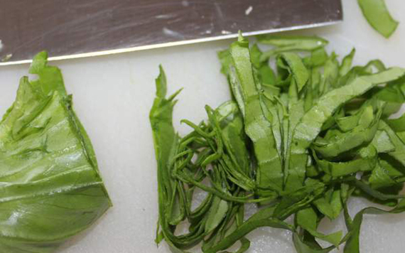 Cutting up your lettuce for egg salad sandwiches.