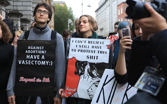 Pro-choice protestors outside Irish government's buildings, calling for a repeal of the 8th Amendment.