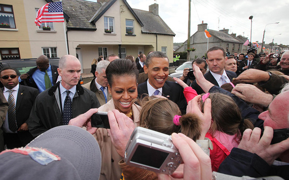 Michelle and Barack Obama greet the crowds in Moneygall in 2011.