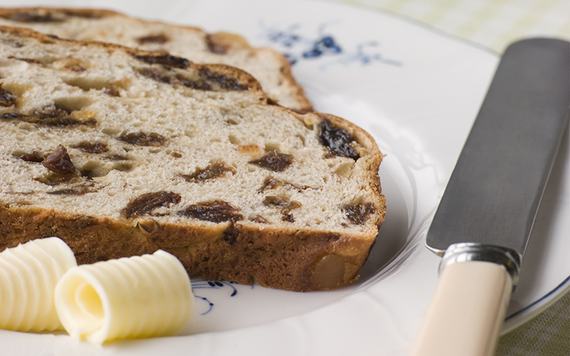Delicious fruity barm brack with butter for Halloween.