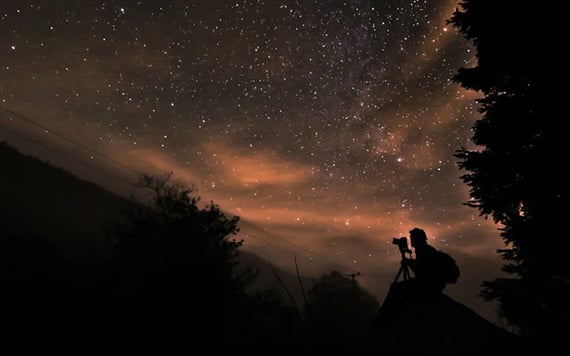 Astrophotographer studying the night sky.