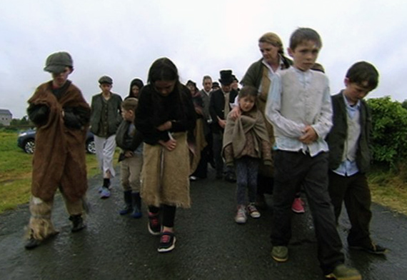Children walk in character in the footsteps of the victims from 1847.