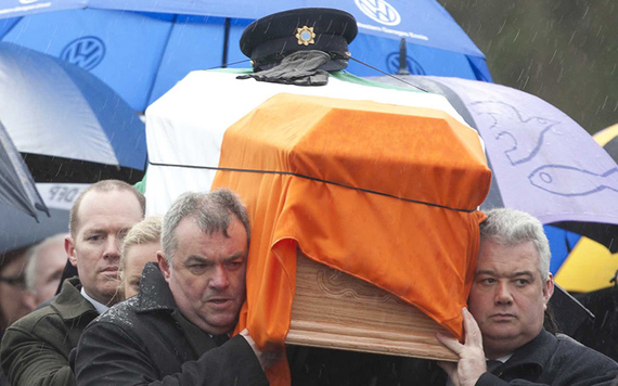 The coffin of Detective Garda Adrian Donohoe draped in the Irish tricolor.