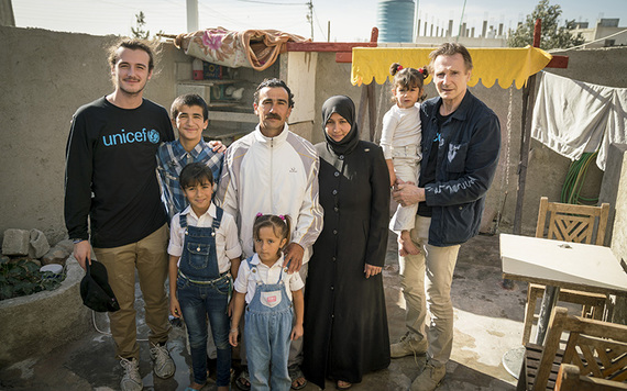 UNICEF Ambassador Liam Neeson and his son Michael meet with Syrian refugees.