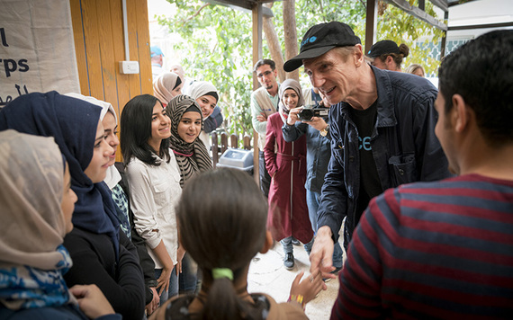 UNICEF Ambassador Liam Neeson and his son Michael meet with Syrian refugees.