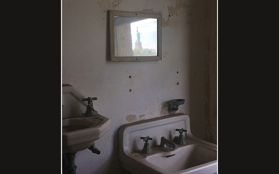 Statue of Liberty seen from a mirror in a room in the contagious disease ward. Photo: Sheila Langan
