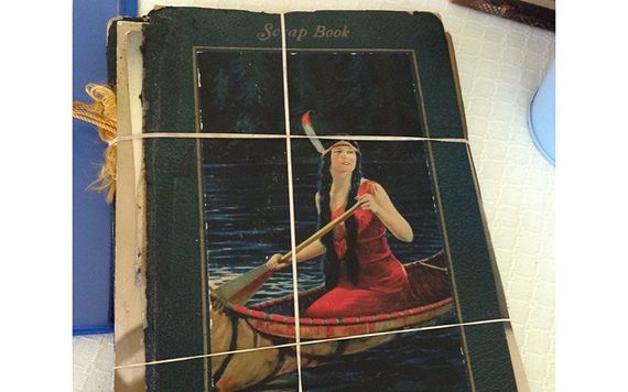 Scrapbook kept by Mike's great aunt Grace filled with obituaries and family history stories. Scrapbooks are treasure troves of family information.
