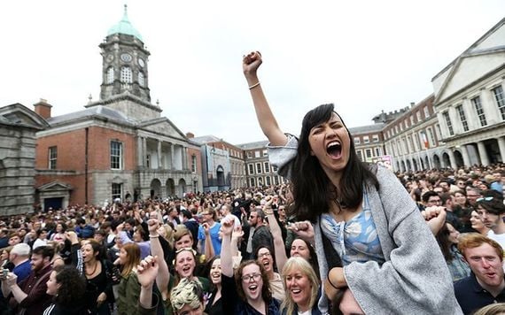 Yes campaigners celebrate landslide victory at Dublin Castle on Saturday.