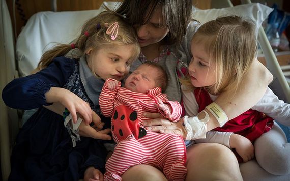 Mother Anna Nowicki with daughters (l-r) Alicja, 10, Nadia, 3, & Ida (1 month).