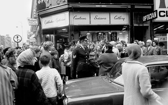 A bean garda (female police officer) directing traffic