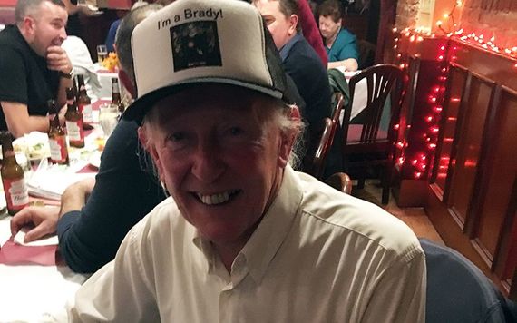 Oliver Bonnes wears a hat with the words I’m a Brady!
