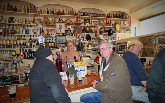 Enjoying the lively company and warmth of Dingle.