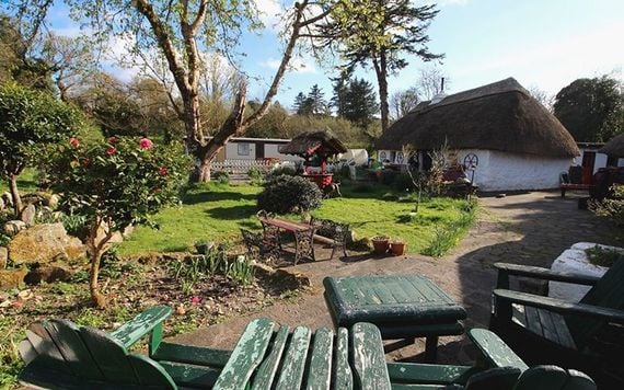 The gardens at Fairybridge thatched homes.