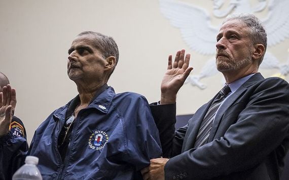 Former NYPD detective Lou Alvarez and Jon Stewart in the US Senate this June.
