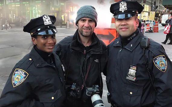 Mark Condren photographed with NYPD officers on the streets of New York.
