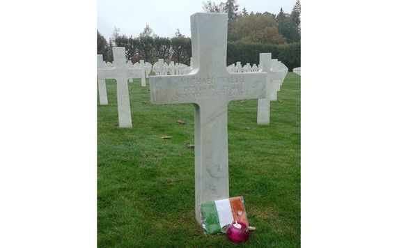 Private Michael Walsh's cross, decorated by his family with an Irish flag, at the Meuse-Argonne American Cemetery near Verdun, France.