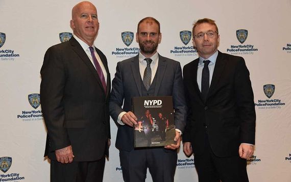 NYPD Commissioner James O’Neill, photographer Mark Condren and Irish Consul General Ciaran Madden.