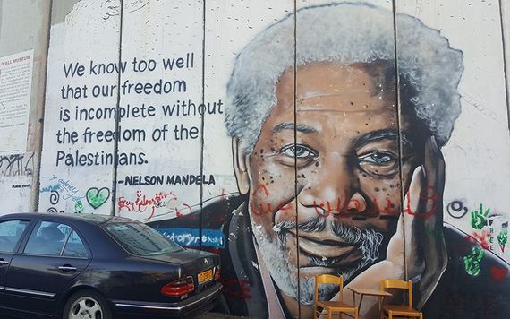 Graffiti of Nelson Mandela along the West Bank border, in Palestine.