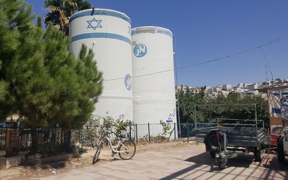 Water tanks supply the Israeli while Palestinian water supply are controlled.