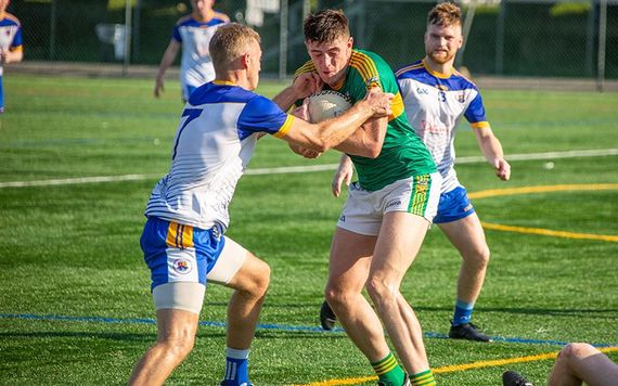 Paudie Clifford is tackled by David Carrick.