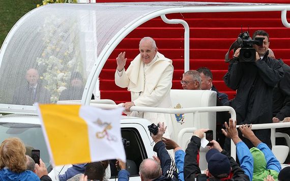 Pope Francis greets the crowds in his Popemobile at the Phoenix Park.