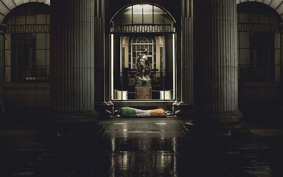 A veteran in a "Sleeping Flag" under the archways at the GPO, on O'Connell Street, in Dublin.