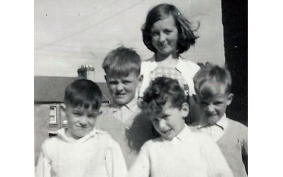A young Jean Farrell with her young brothers.