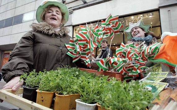 Woman selling shamrock on Henry Street, on St. Patrick's Day.