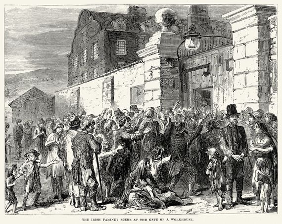 An illustration of Irish gathered outside a workhouse during the Famine. An illustration of Irish gathered outside a workhouse during the Famine.