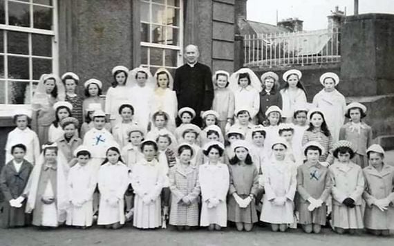 A class photos of the pure girls doing their communions and confirmations. (Via Jean Farrell).