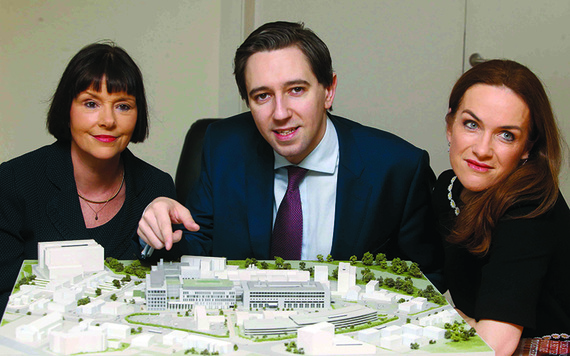 Posing with a model of the new maternity hospital: Project Chief Operating Officer Kay Connolly, Minister for Health Simon Harris, and Dr Rhona Mahony Master.