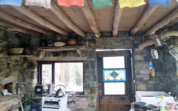 Tibetan prayer flags hanging inside Dan Hummel's sitting room. Image: Brian Keane.