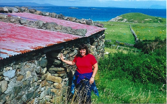 Farrell's daughter Tracey by the cottage. Image: Tom Farrell. 