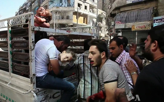 Civilians transfer wounded to hospital in Aleppo following bombings.