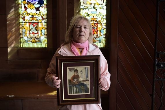 Linda Nash poses with a photo of her brother William Nash, who died during Bloody Sunday, following a press conference in reaction to today's Bloody Sunday prosecution announcement at Guildhall on March 14, 2019, in Derry, Northern Ireland. (Photo by Liam McBurney - WPA Pool/Getty Images)
